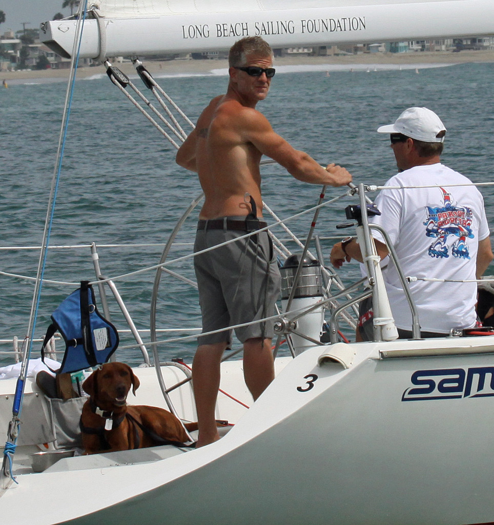  U.S. Army National Guard team member Ryan Healy at the helm with his service dog J.J. during the regatta.