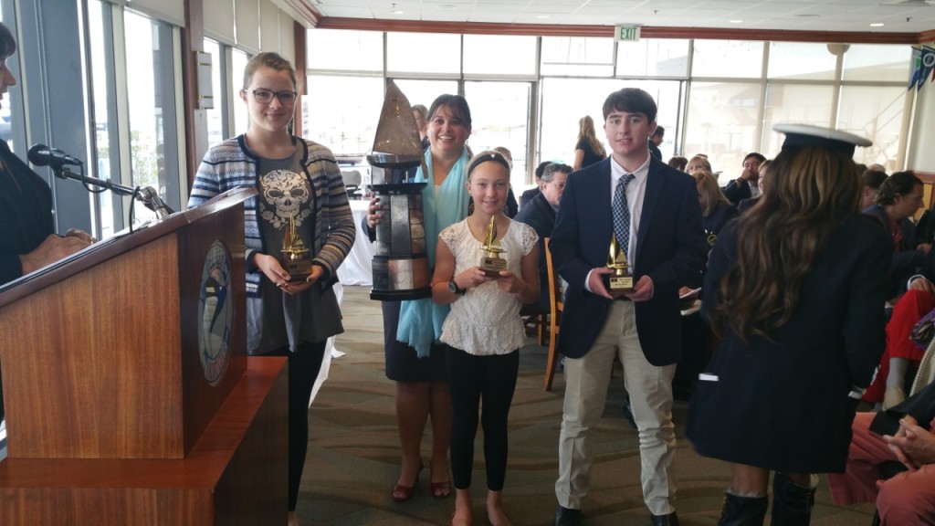 King Harbor Yacht Club member Emma Tallman, center, recently received the Diane Armstrong Award.
