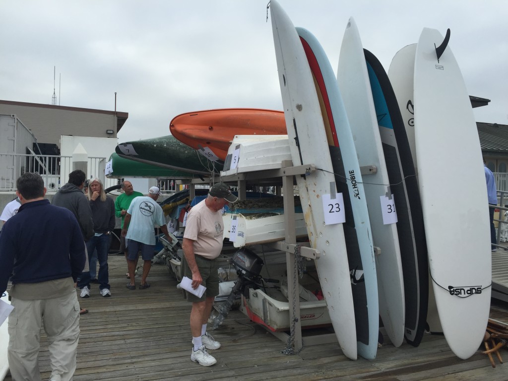Potential buyers examine boats up for bid at the city of Newport Beachs March 18 boat auction. Parimal M. Rohit photo.