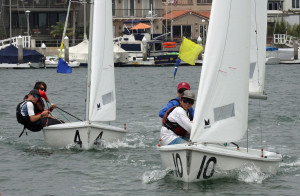 Pictured left to right: Santa Barbara Yacht Club team members David Eastwood and Christopher Kayda chase San Diego YC team members Jack Reiter and Jack Egan during a critical race in the 2016 Long Beach Yacht Club Junior Match Race Invitational.Rick Roberts photo